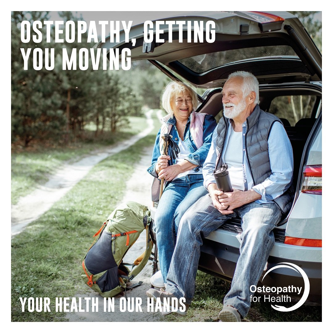 Older couple sitting in boot of car